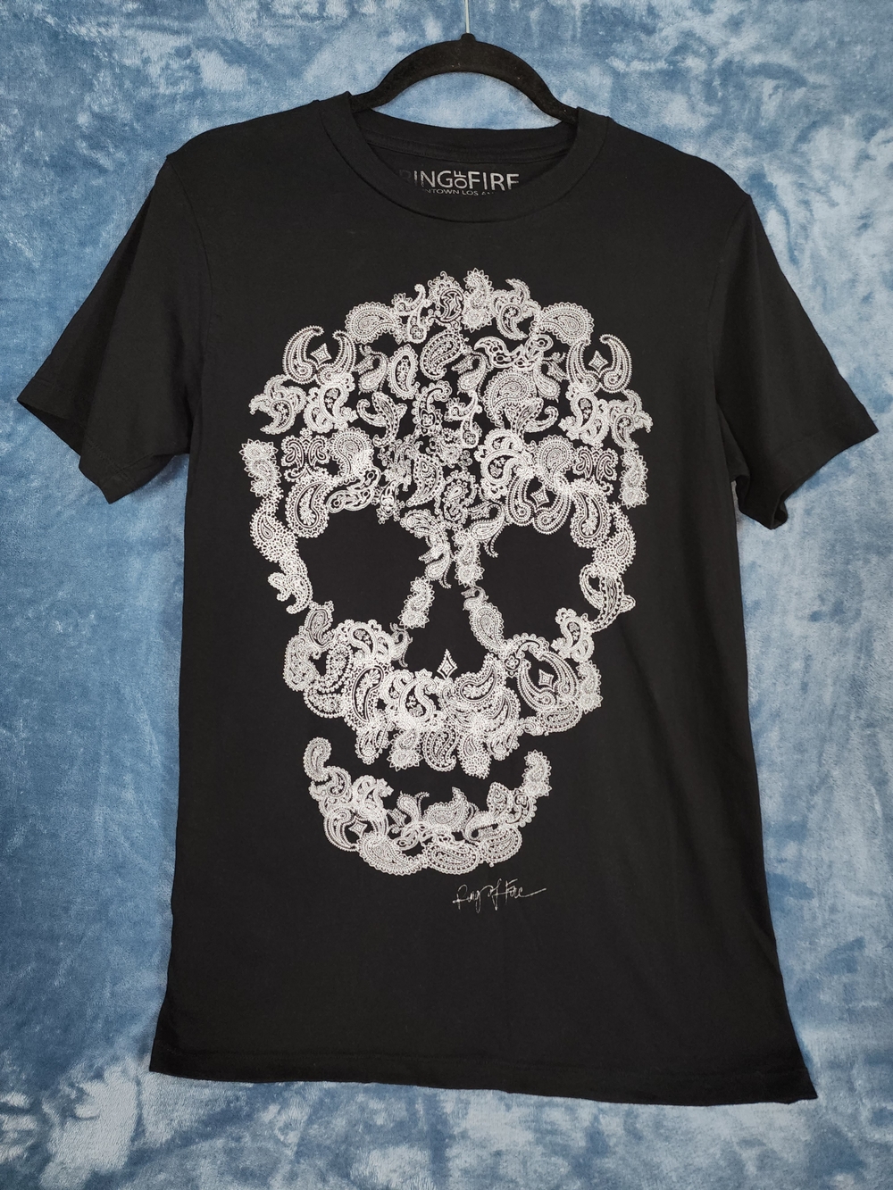 Ring of Fire Black Tee with White Paisley Skull Graphic